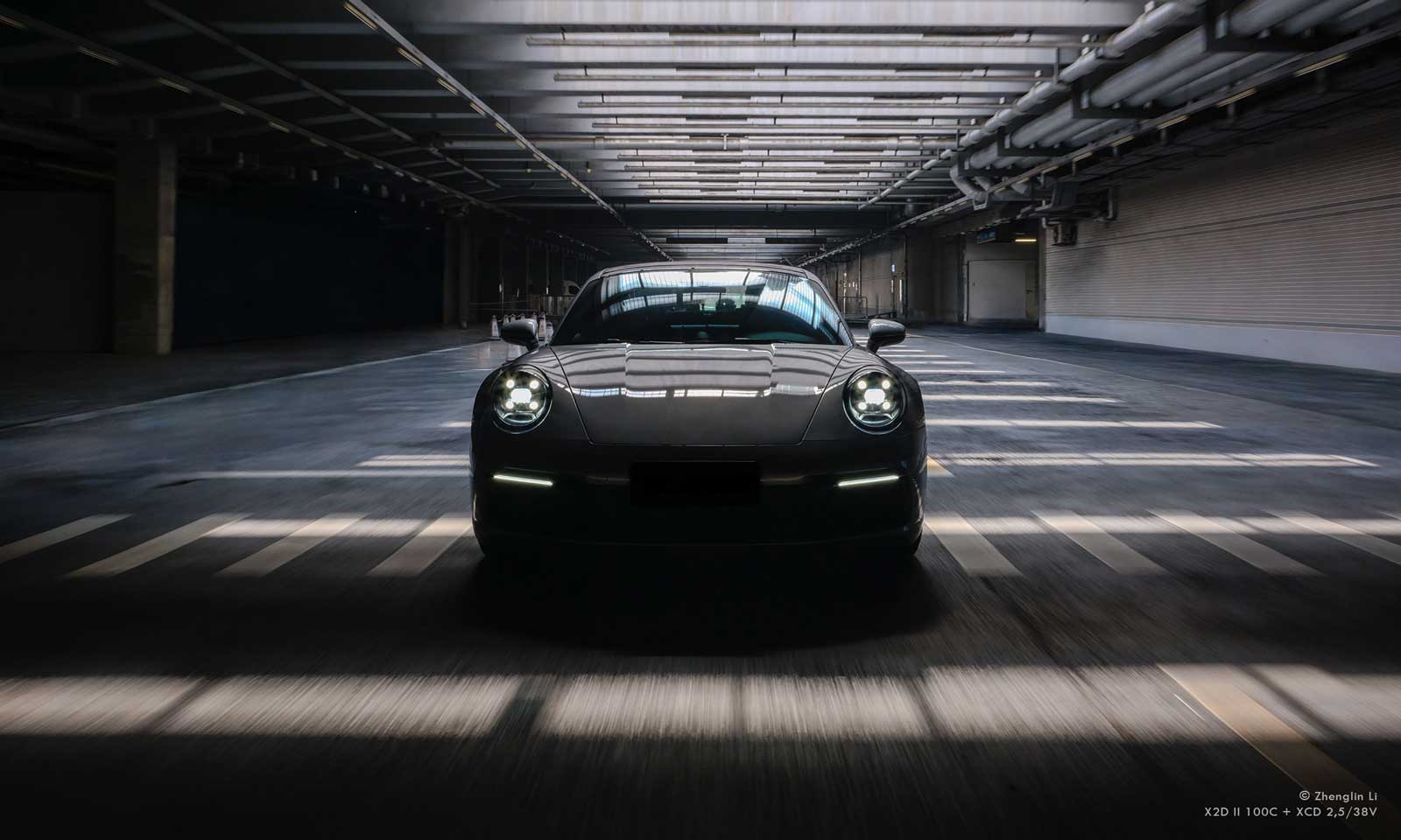 Hasselblad X2D II 100C Sample photograph of Porshe 911 travelling through industrial tunnel
