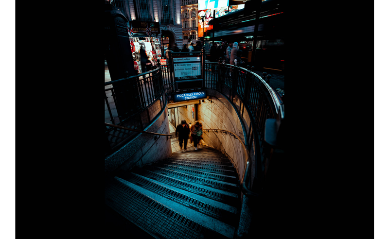 Hasselblad XCD 25V sample image of 2 people walking up picadilly circus station stairs at night time