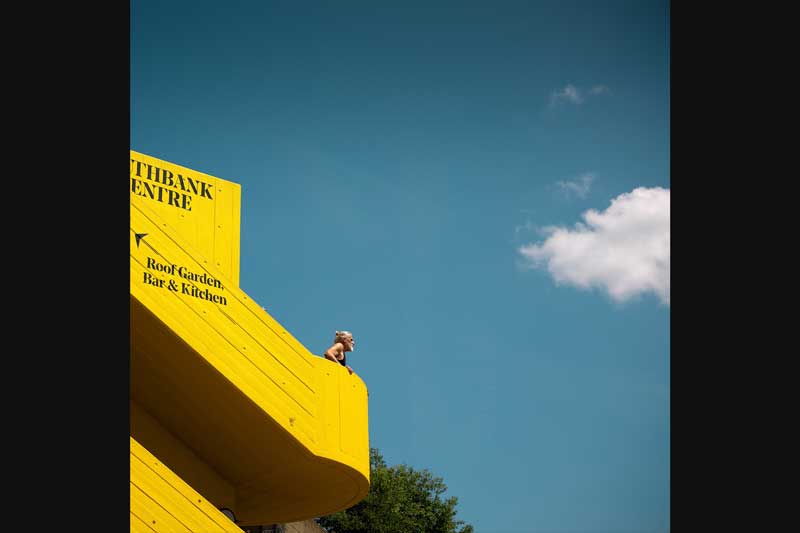 XCD 2.8-4/35-100E sample image of man standing on bright yellow stair case