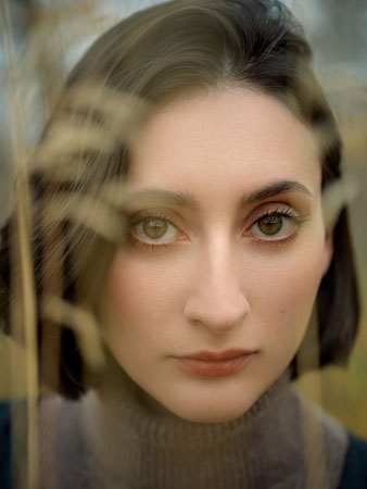 Hasselblad XCD 75P Sample image of of brunette woman with deep brown eyes staring into lens 