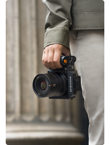 photographer carrying hasselblad X2D 100c with XCD 75p lens