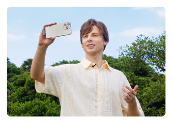 someone using the hollyland wireless microphone connected to a smartphone