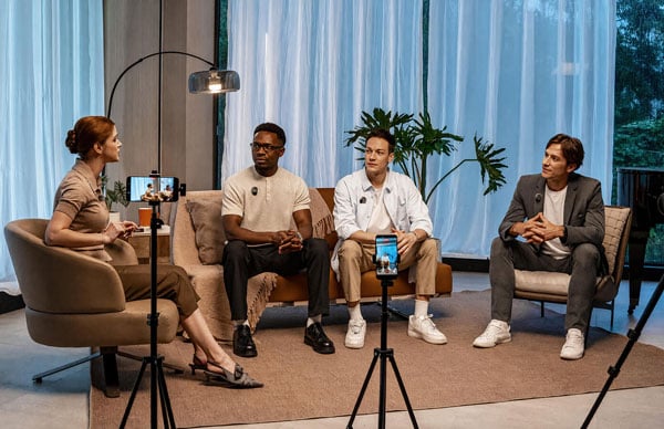 Four people participating in a recorded interview using the hollyland lark m3