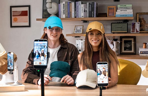  Influencers live streaming a product demonstration while wearing the hollyland mics on their caps