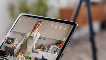 tablet with HollyView app video preview of female chef in kitchen