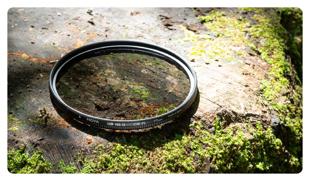 hoya 77mm hd mk ii cir-pl circular polarizing filter on a moss covered rock