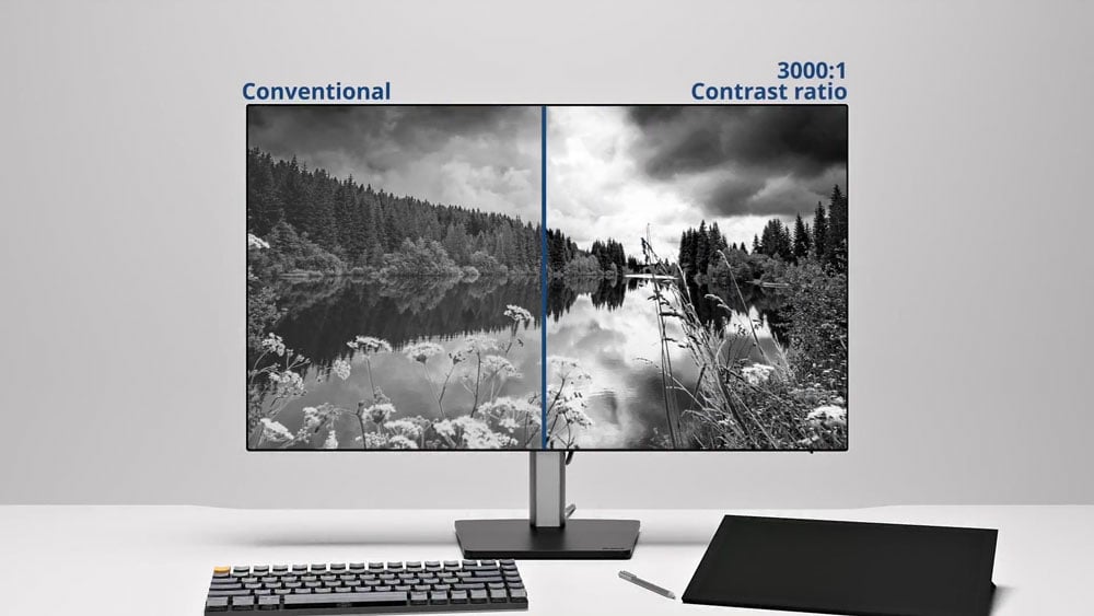 iiyama monitor on a desk showing a black and white image of a lake comparing the 3000:1 contrast ratio to conventional monitors