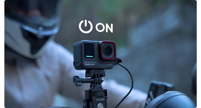 Image of insta360 mounted to motorcyclists handle bars with on symbol above the camera