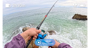 Pre recording sample image from insta360 ace pro of person sea fishing from coastal rocks