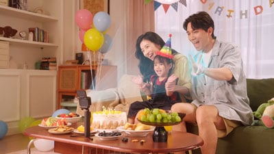 illustrated photograph of family using gesture control on INsta360 GO Ultra