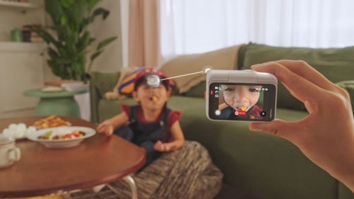 Parent controlling INsta360 GO Ultra recording with Action Pod