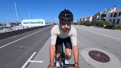 Cyclist riding competition bike with insta360 Go ultra