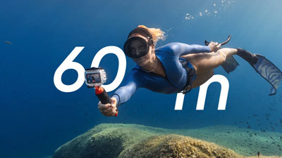 underwater diver using the insta360 go ultra dive case