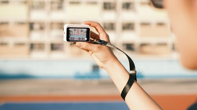 someone using the Insta360 GO Ultra Quick Release Wrist Strap