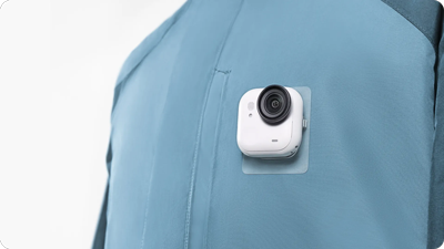 insta360 go ultra stuyck to a shirt using the sticky tabs