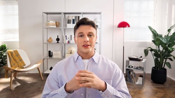 hdr footage from the insta360 link 2 pro of a man in a meeting in a white room