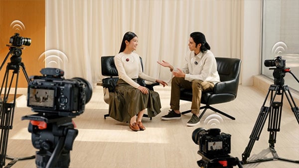 2 women being filmed by 4 cameras during an interview