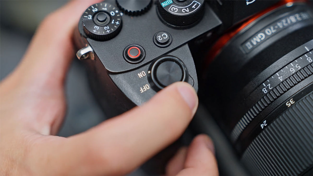 someone turnign a camera connected to the mic pro