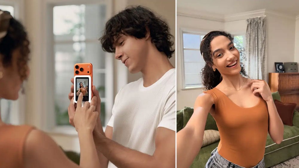 someone looking at the Insta360 Snap to preview a selfie
