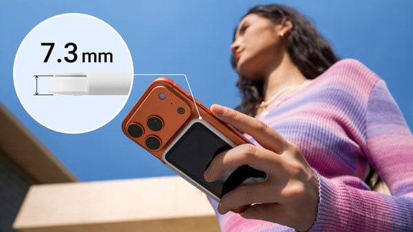 someone holding a smartphone with the Insta360 Snap connected and zoomed in view showing the thickness