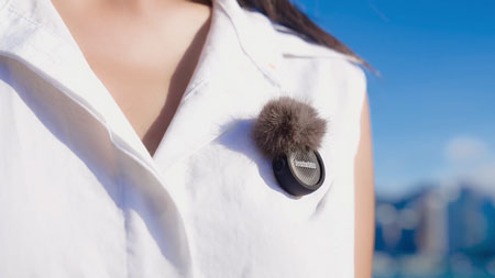 insta 360 mic attached to someones shirt