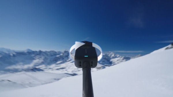 someone twisting the insta360 x6 on a selfie stick