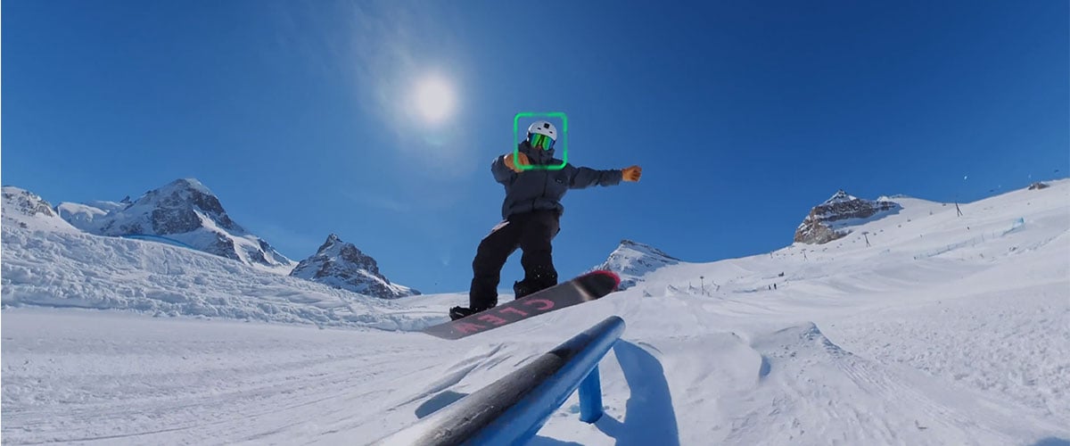 snowboarder jumping on a rail with smart tracking ui