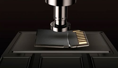 a normal memory card being crushed during testing