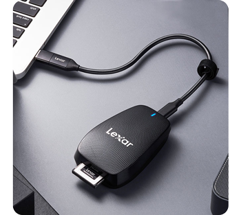 lexar professional CFexpress type B card reader connected to macbook pro sitting on grey table