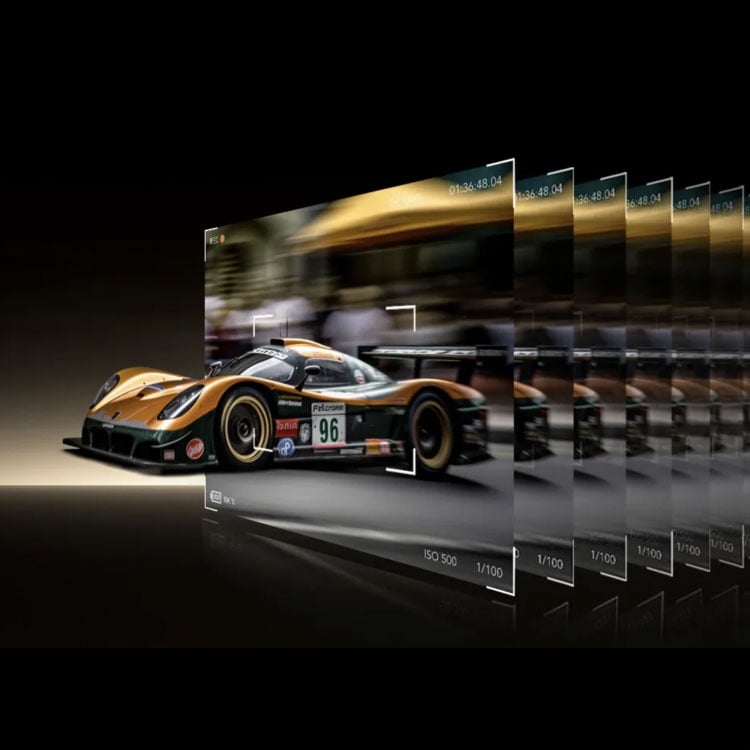 different frames from a video of a race car layered on top of each other with the car coming out of the top frame
