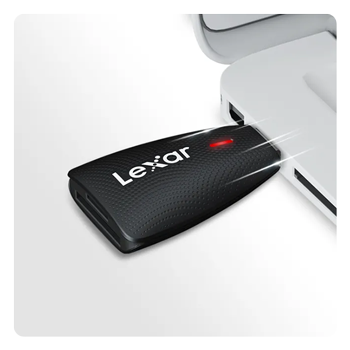 usb card reader being plugged into a laptop