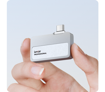 person holding silver lexar professional Go Portable SSD