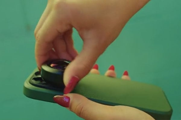 fisheye lens being attached to a phone