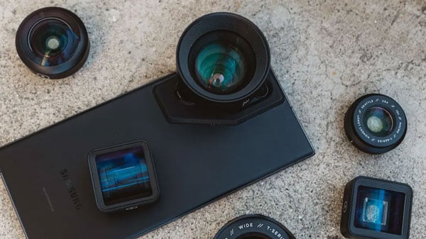 tele mobile lens attached to a phone with other compatible lenses around it