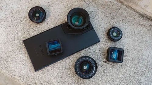phone in a moment case surrounded by different mobile lenses