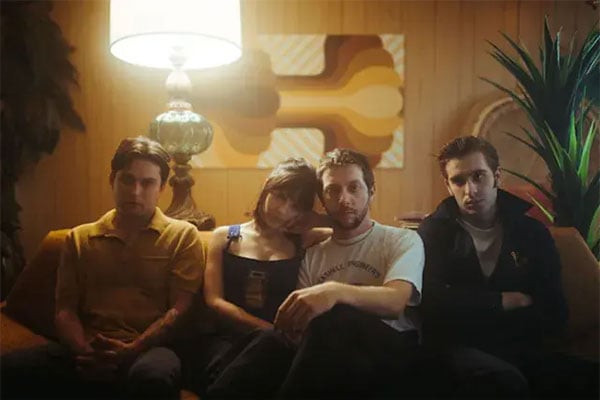 sample image of four people sat on a sofa taken using the cinebloom filter