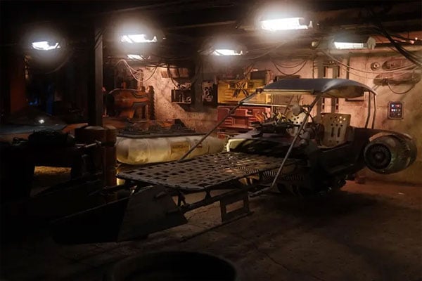 sample image of a car stripped down inside a workshop taken with the cinebloom filter