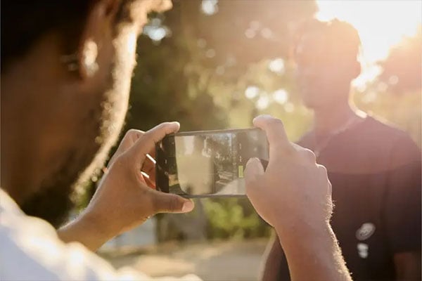someone taking a photo using the cinebloom filter