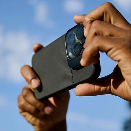 somone taking a photo using the CineClear UV QuickLock Filter