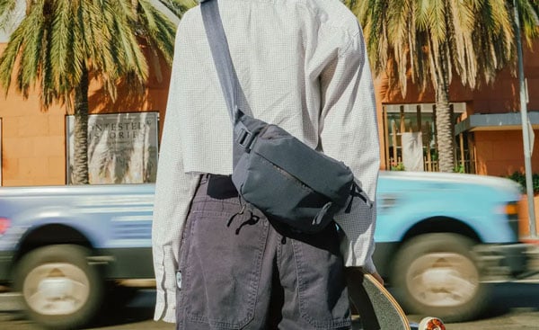 close up of someone wearing the sling bag on their back