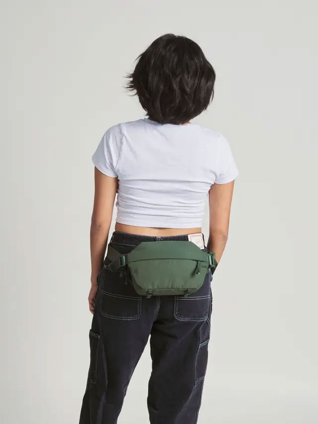 someone wearing the sling bag around their waist