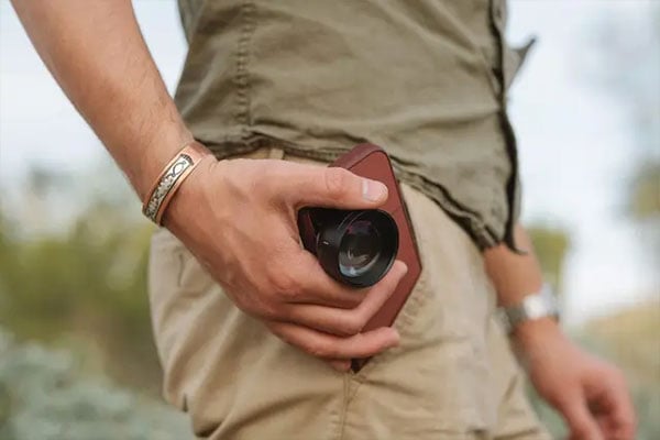 someone holding a phone with the moment macro mobile lens