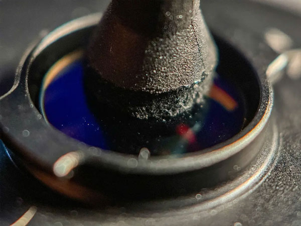 close up of the mobile lens cleaning pen pad