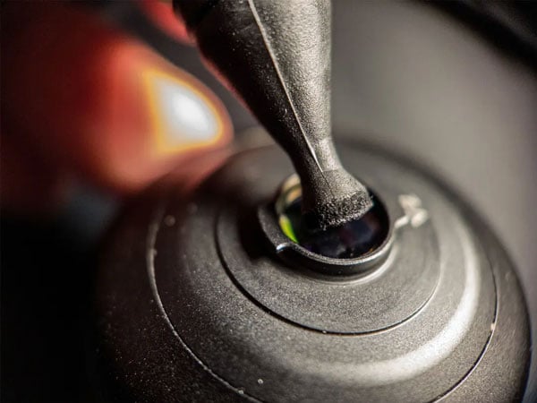 close up of the mobile lens cleaning pen pad cleaning a moment m-series lens