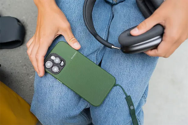 somone with a phone on their lap in a moment case