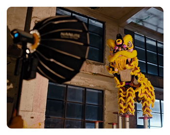 dragon dancers lit up with the effects from the nanlite fc 120b