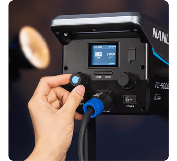person adjusting control dials of Nanlite FC-500B LED Light