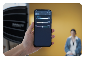 someone adjusting the nanlite fc 500c using the nanlite app