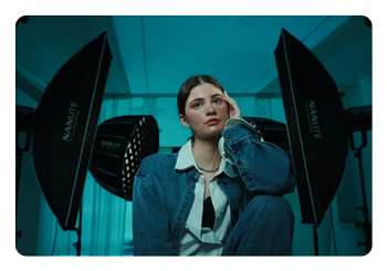 a woman kneeling surrounded by the nanlite fc 500c