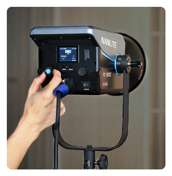 someone adjusting the onboard controls of the nanlite fc 500c
